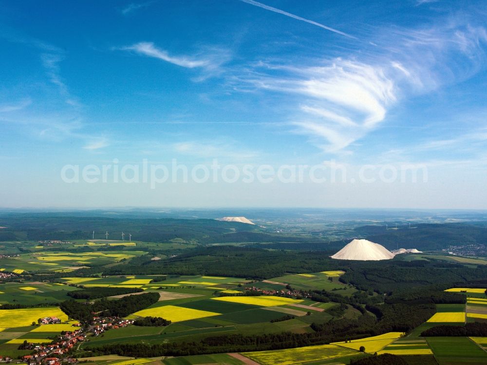 Aerial image Heringen (Werra) - Landscape of the Werra Potash region near Heringen (Werra) in the state of Hesse. View from the village of Oberbreitzbach to the North. The two white hills, which stand out from the landscape, are the overburden piles of the potash works in Philippsthal and Widdershausen. The potash region where the potash salts are won underground, is located along the river Werra
