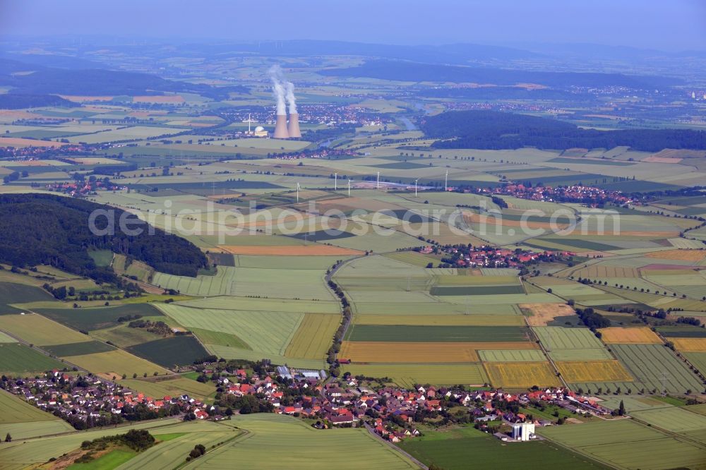 Heyen / Grohnde from above - Landscape view of the Weser Valley. In the foreground is the town of Heyen, in the background is the Nuclear power plant Grohnde in the state of Lower Saxony. The plant has a pressurized water reactor and is located at the river Weser in the county district of Hameln - Pyrmont. The here produced power is fed into the high-voltage network