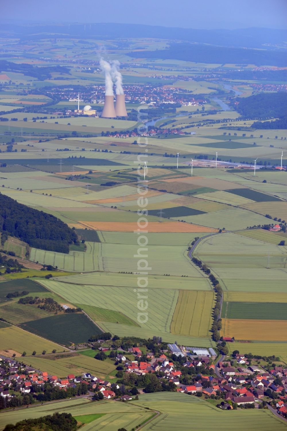 Aerial image Heyen / Grohnde - Landscape view of the Weser Valley. In the foreground is the town of Heyen, in the background is the Nuclear power plant Grohnde in the state of Lower Saxony. The plant has a pressurized water reactor and is located at the river Weser in the county district of Hameln - Pyrmont. The here produced power is fed into the high-voltage network