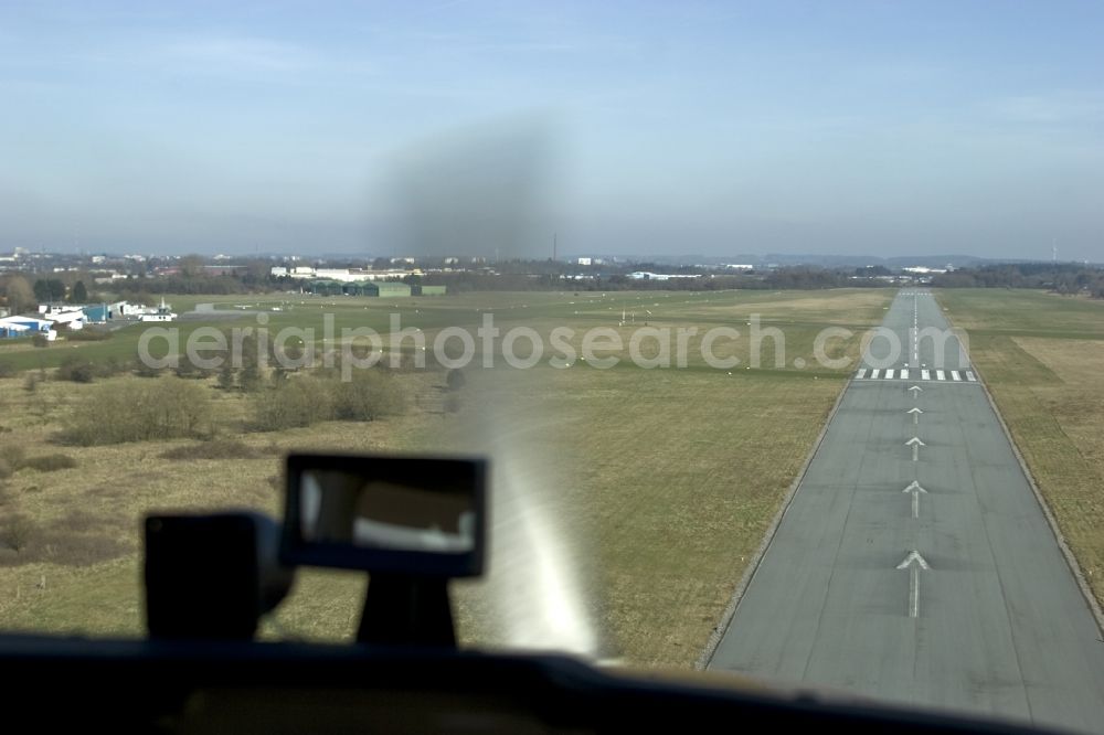 Aerial photograph Handewitt - Landing of a propeller-driven aircraft on the airfield Flensburg-Schaeferhaus in Handewitt in Schleswig-Holstein
