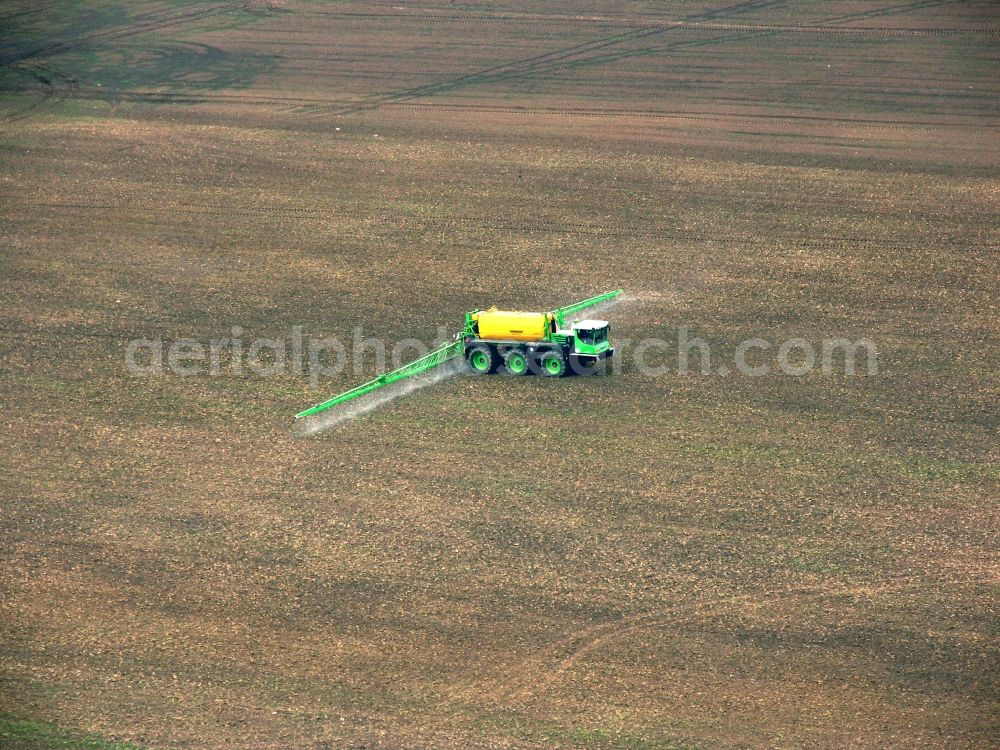 Aerial photograph Alkersleben - The farm work on the Getriedefeld at Alkersleben in Thuringia