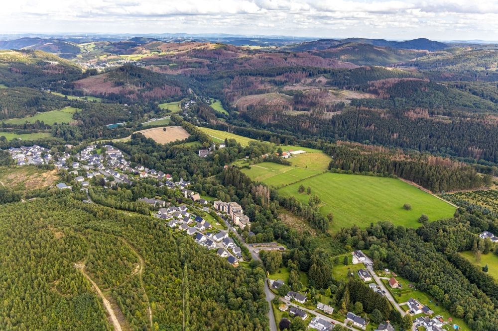 Aerial image Brilon - Agricultural land and field borders surround the settlement area of the village in the district Gudenhagen in Brilon in the state North Rhine-Westphalia, Germany