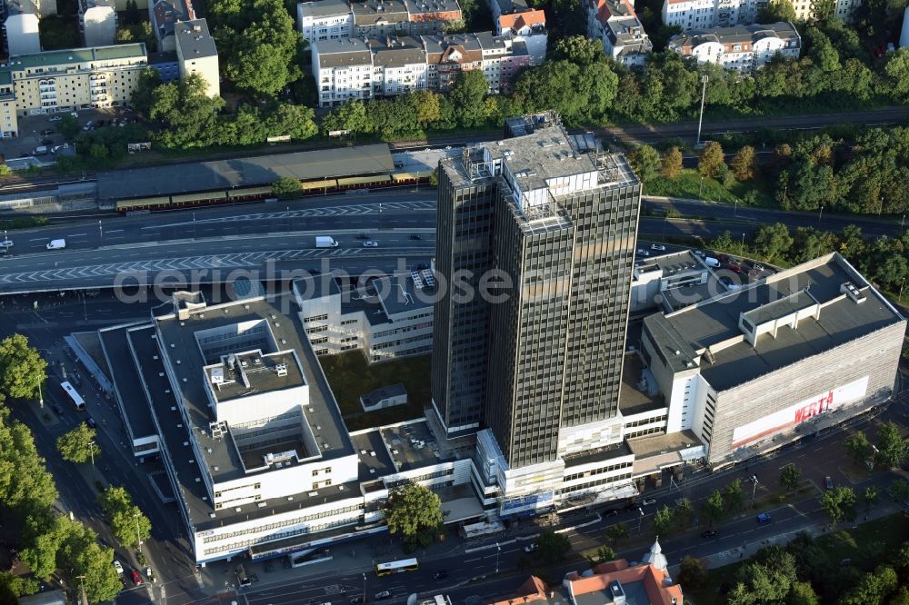 Aerial image Berlin - Empty and vacated highrise building of the Steglitzer Kreisel complex on Schlossstrasse in the district of Steglitz-Zehlendorf in Berlin. The facilities include a hotel, shops and stores but the office building tower is empty