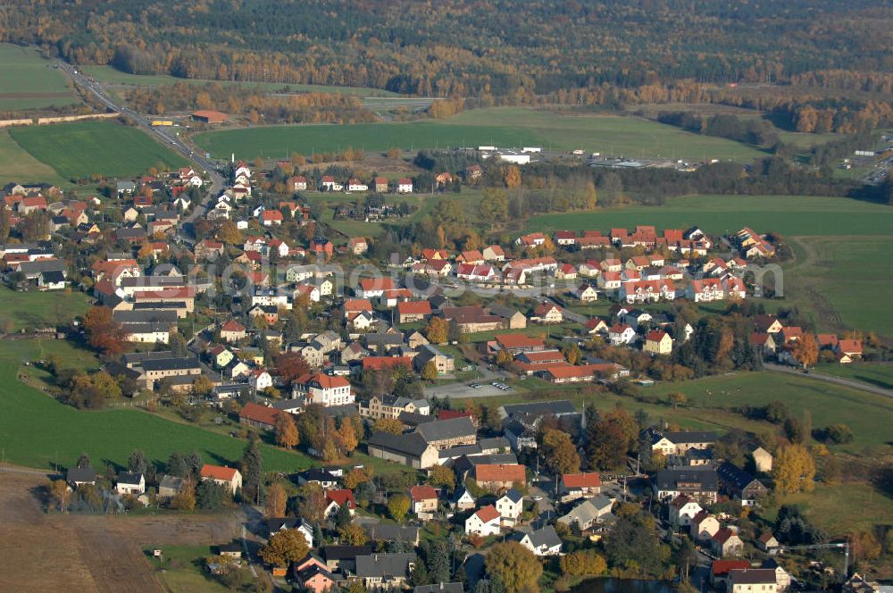 Aerial image Leppersdorf - Blick auf den sächsischen Ort Leppersdorf im Landkreis Bautzen. Der Ort ist weitgehend von ausgedehnten landwirtschaftlichen Anbau- und Waldflächen umgeben. In unmittelbarer Nähe befindet sich ein hochmodernes Milchverarbeitungswerk der Sachsenmilch AG, in dem etwa 1.700 Mitarbeiter beschäftigt werden.