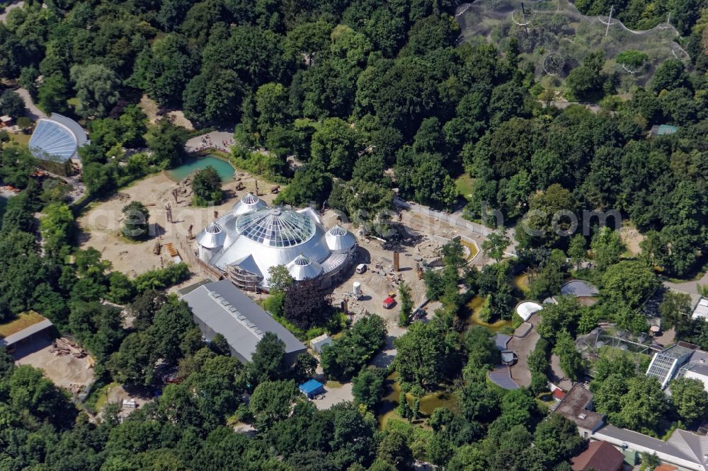 München from the bird's eye view: Last refurbishment construction work of the elephant house in the zoo Hellabrunn in Munich in Bavaria. The listed domed building is undergoing extensive restoration work after the collapse of the so called Rabitzdecke. The formerly green dome is now covered silvery. The historic roof crowns are freshly gilded. Completion is scheduled for October 2016