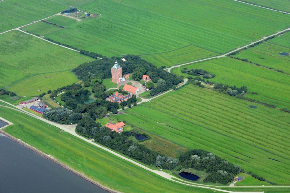 Aerial photograph Hamburg - Lighthouse as a historic seafaring character in the coastal area of Nort Sea island Neuwerk in Hamburg in Germany
