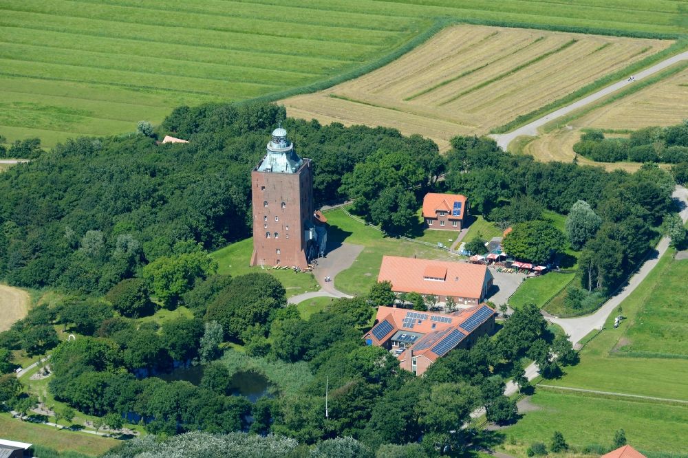 Aerial image Hamburg - Lighthouse as a historic seafaring character in the coastal area of Nort Sea island Neuwerk in Hamburg in Germany