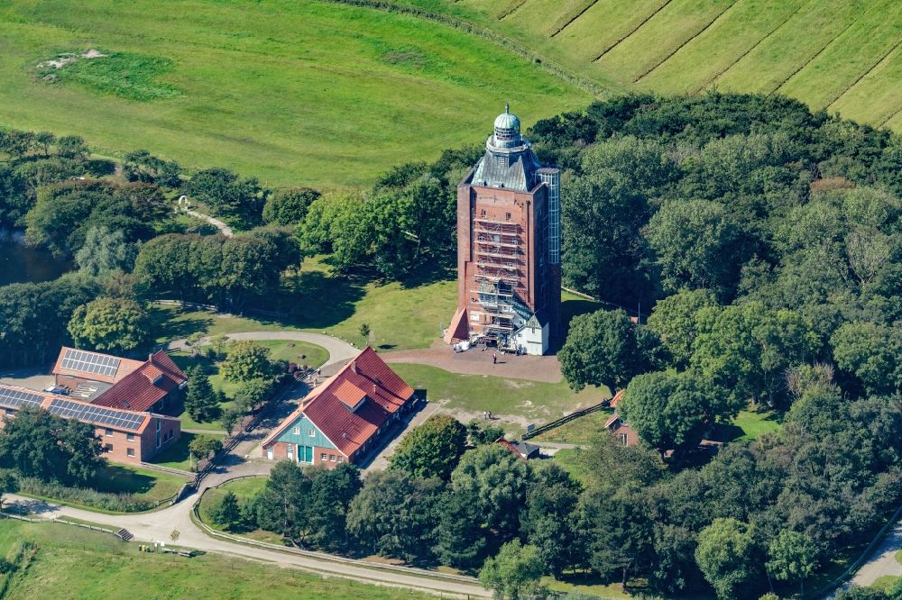 Aerial image Hamburg - Lighthouse as a historic seafaring character in the coastal area of Nort Sea island Neuwerk in Hamburg in Germany