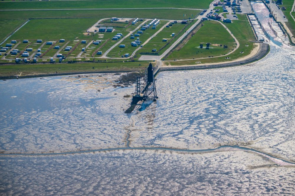 Wurster Nordseeküste from the bird's eye view: Lighthouse as a historic seafaring character in the coastal area of North Sea in the district Dorum in Wurst Nordseekueste in the state