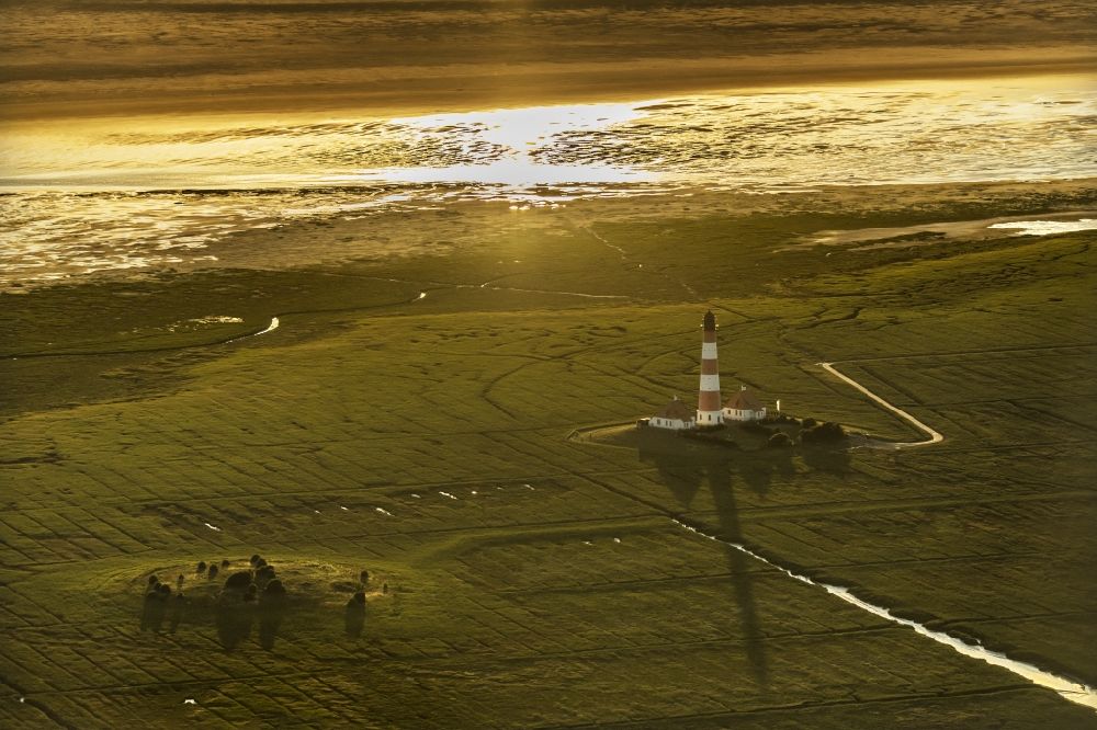 Aerial photograph Westerhever - Lighthouse as a historic seafaring character in the coastal area of North Sea in the district Hauert in Westerhever in the state Schleswig-Holstein