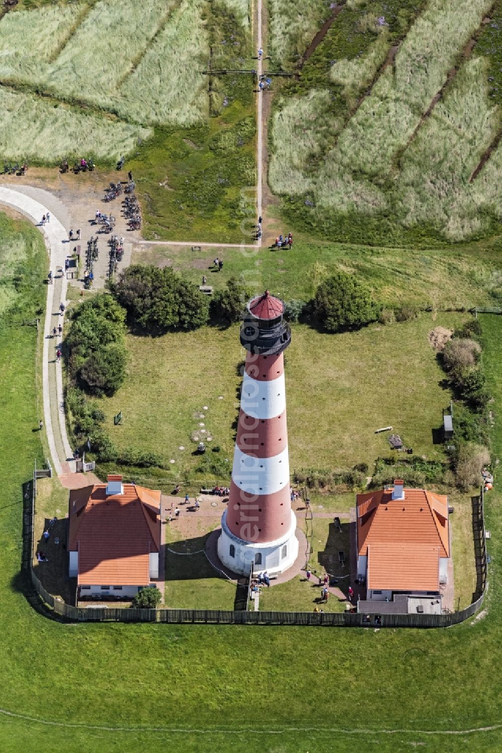 Westerhever from above - Lighthouse as a historic seafaring character in the coastal area of North Sea in the district Hauert in Westerhever in the state Schleswig-Holstein
