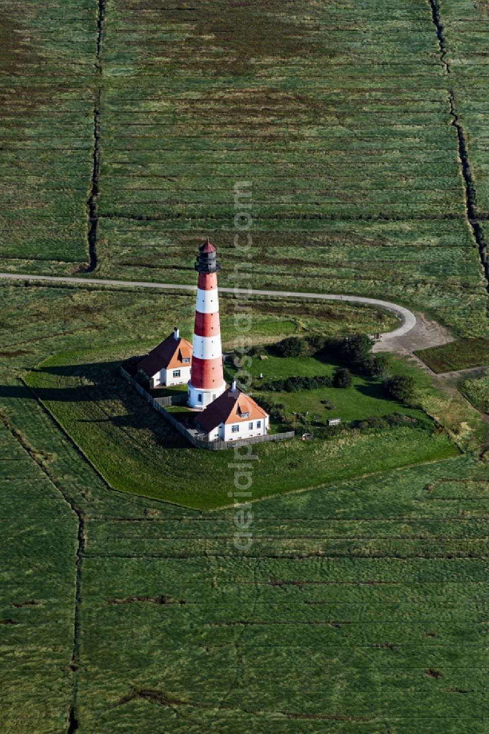 Aerial photograph Tating - Lighthouse as a historic seafaring character in the coastal area of North Sea in the district Hauert in Westerhever in the state Schleswig-Holstein