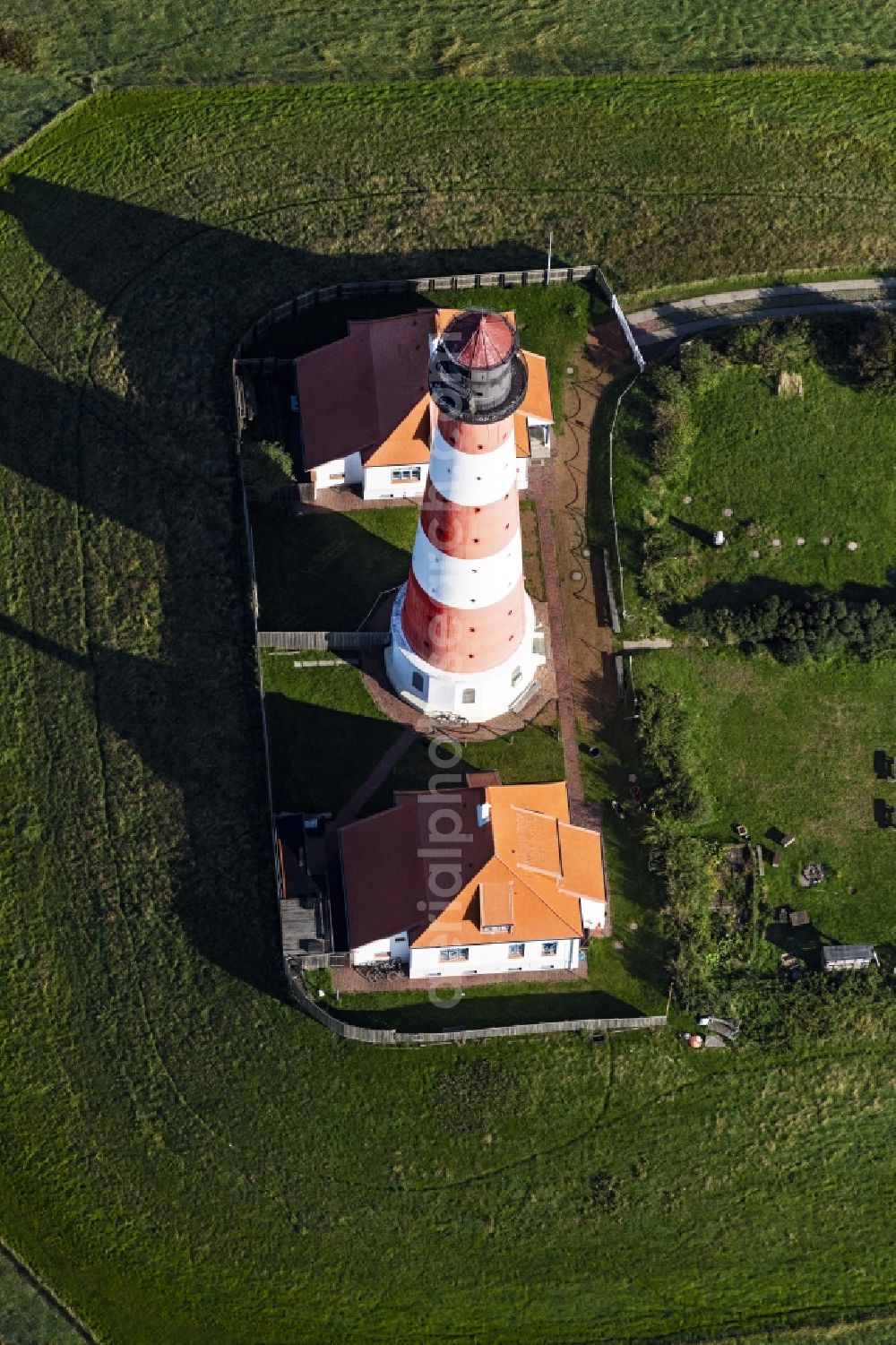 Aerial image Tating - Lighthouse as a historic seafaring character in the coastal area of North Sea in the district Hauert in Westerhever in the state Schleswig-Holstein