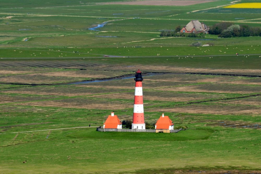 Aerial image Tating - Westerheversand lighthouse as a historic seafaring character in the coastal area of the North Sea in Tating in the state of Schleswig-Holstein