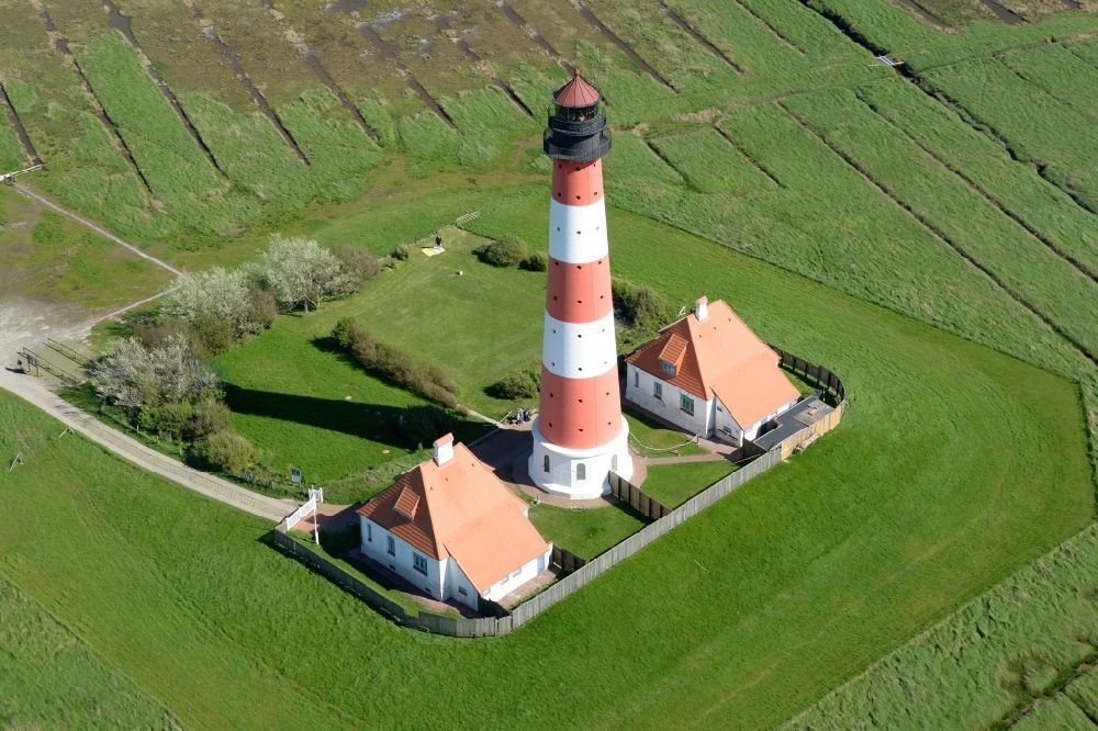 Aerial image Tating - Westerheversand lighthouse as a historic seafaring character in the coastal area of the North Sea in Tating in the state of Schleswig-Holstein
