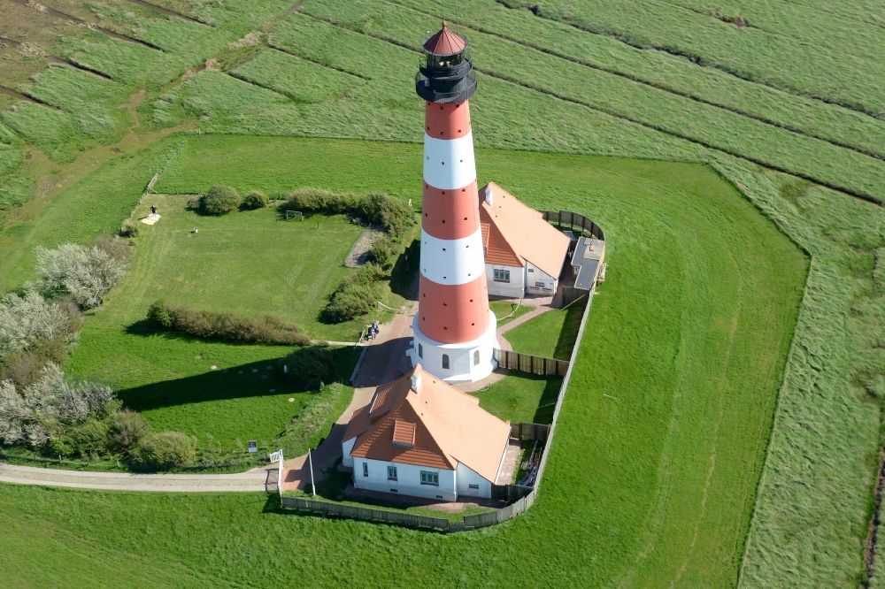 Aerial photograph Tating - Westerheversand lighthouse as a historic seafaring character in the coastal area of the North Sea in Tating in the state of Schleswig-Holstein