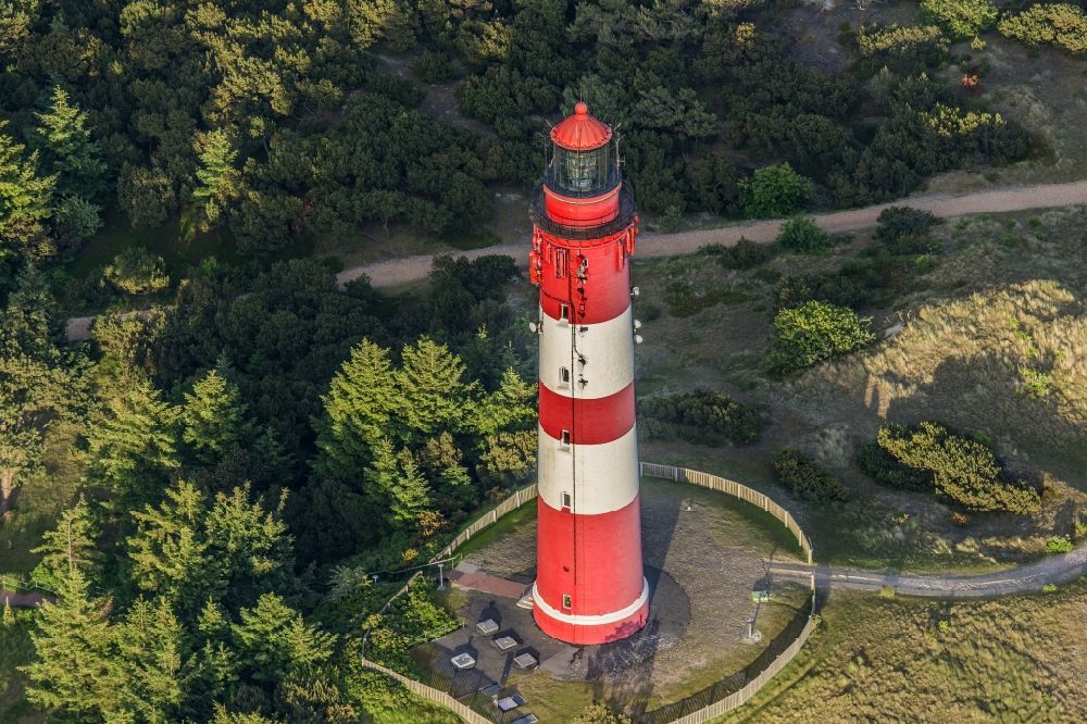 Aerial photograph Nebel - Lighthouse as a historic seafaring character in the coastal area of the North Sea in Wittduen auf Amrum in the state Schleswig-Holstein