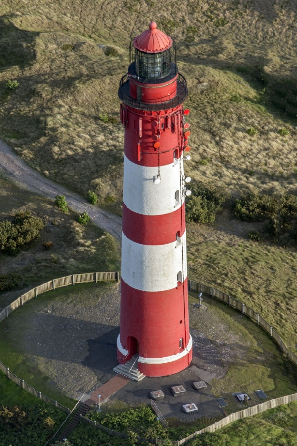 Nebel from the bird's eye view: Lighthouse as a historic seafaring character in the coastal area of the North Sea in Wittduen auf Amrum in the state Schleswig-Holstein