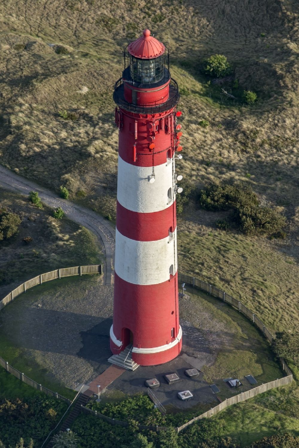Aerial image Nebel - Lighthouse as a historic seafaring character in the coastal area of the North Sea in Wittduen auf Amrum in the state Schleswig-Holstein