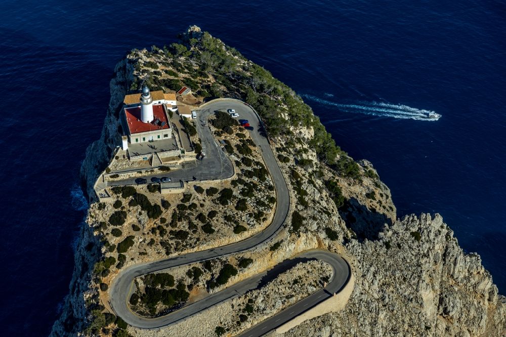 Pollenca from the bird's eye view: Lighthouse as a historic seafaring character in the coastal area in Pollenca in Balearische Insel Mallorca, Spain