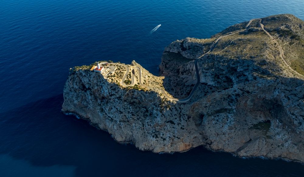 Aerial photograph Pollenca - Lighthouse as a historic seafaring character in the coastal area in Pollenca in Balearische Insel Mallorca, Spain