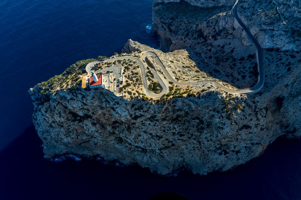 Aerial photograph Pollenca - Lighthouse as a historic seafaring character in the coastal area in Pollenca in Balearische Insel Mallorca, Spain