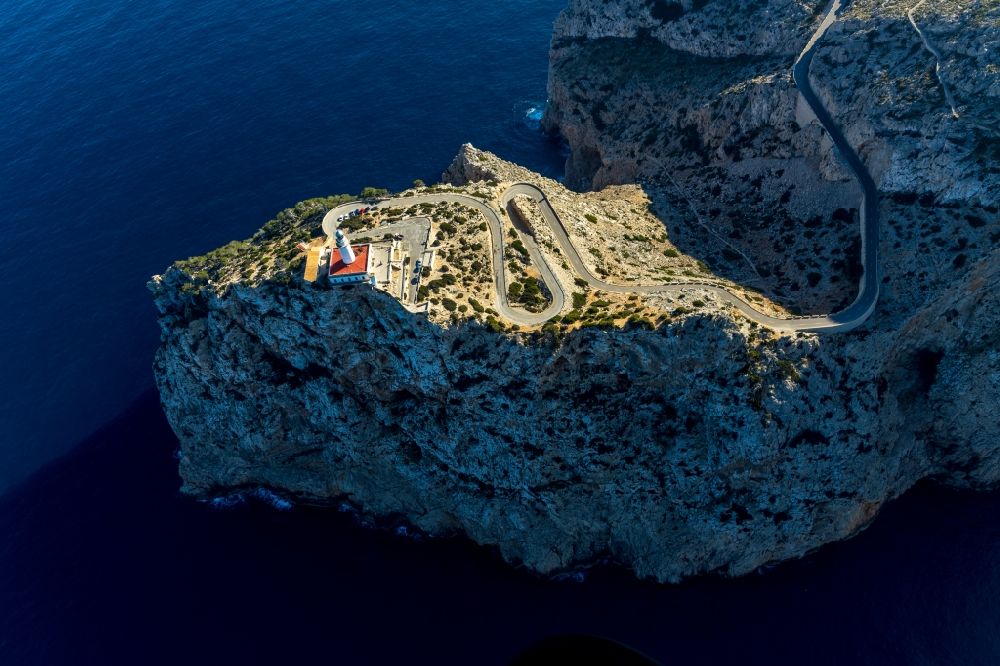 Pollenca from above - Lighthouse as a historic seafaring character in the coastal area in Pollenca in Balearische Insel Mallorca, Spain