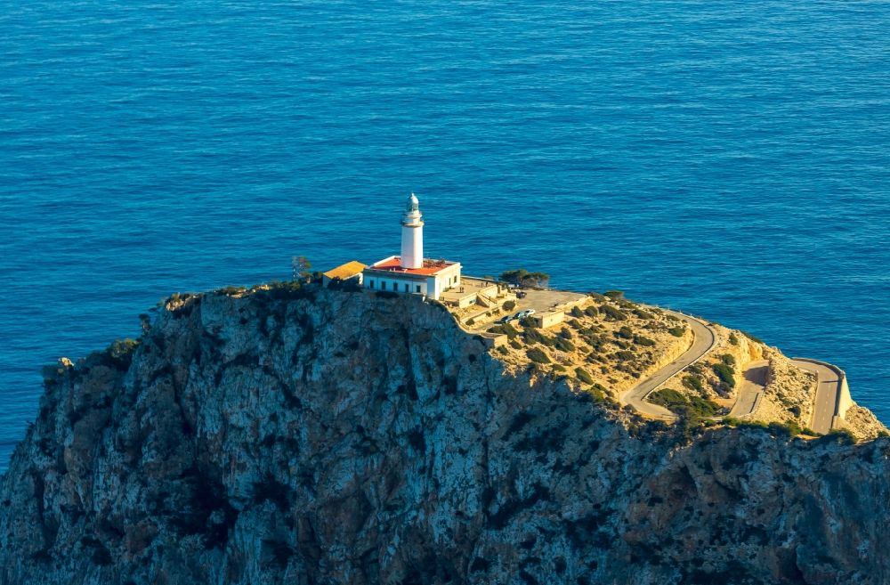 Pollenca from above - Lighthouse as a historic seafaring character in the coastal area in Pollenca in Balearische Insel Mallorca, Spain