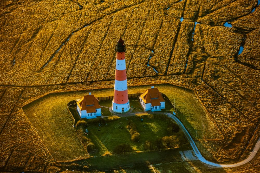 Tating from above - Lighthouse as a historical navigation sign in the coastal area Westerheversand in the district of Hauert in Westerhever in the federal state Schleswig-Holstein