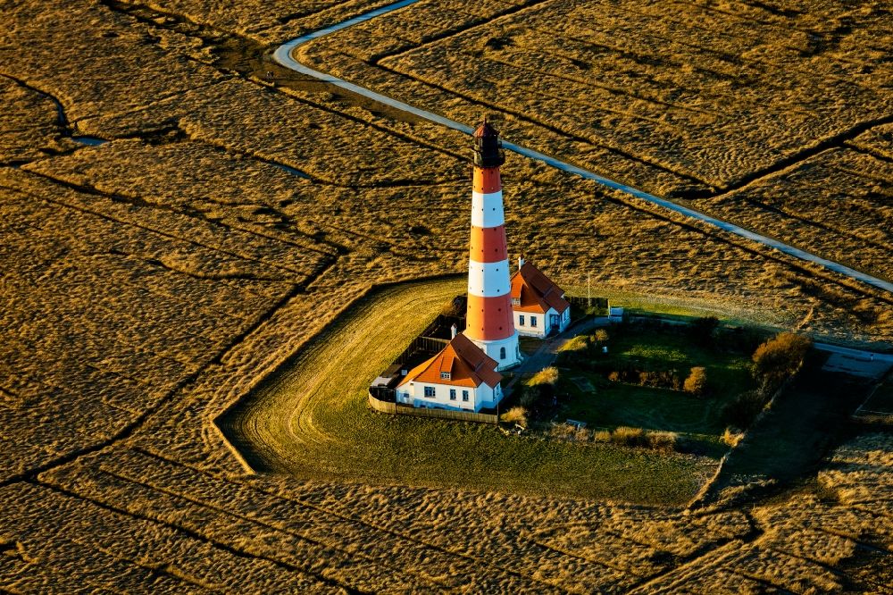 Tating from above - Lighthouse as a historical navigation sign in the coastal area Westerheversand in the district of Hauert in Westerhever in the federal state Schleswig-Holstein