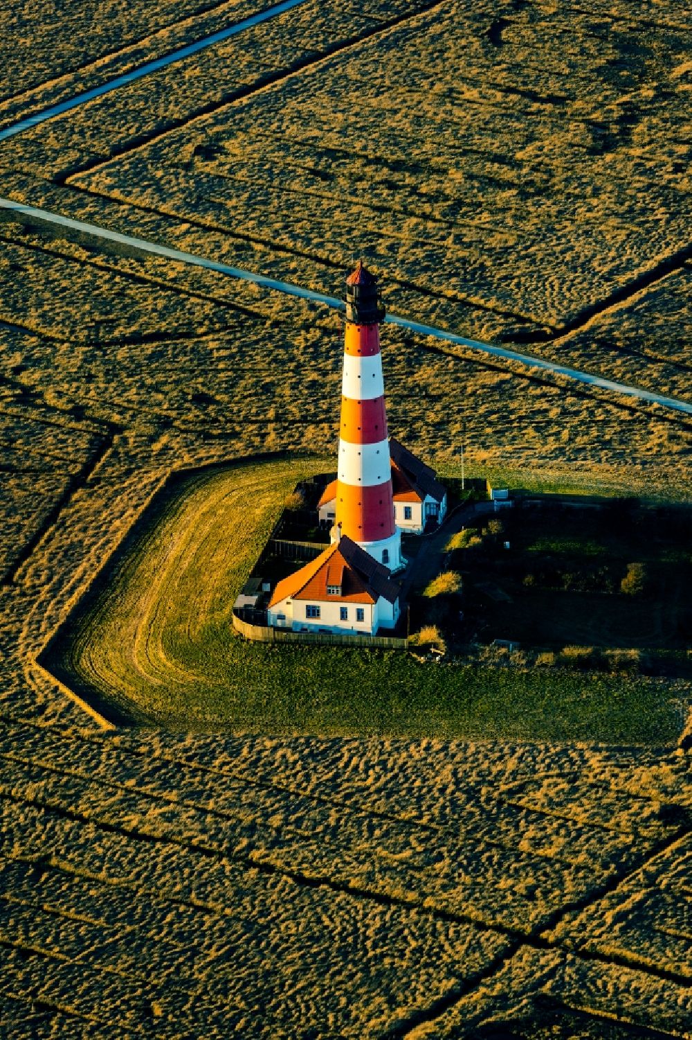 Tating from the bird's eye view: Lighthouse as a historical navigation sign in the coastal area Westerheversand in the district of Hauert in Westerhever in the federal state Schleswig-Holstein