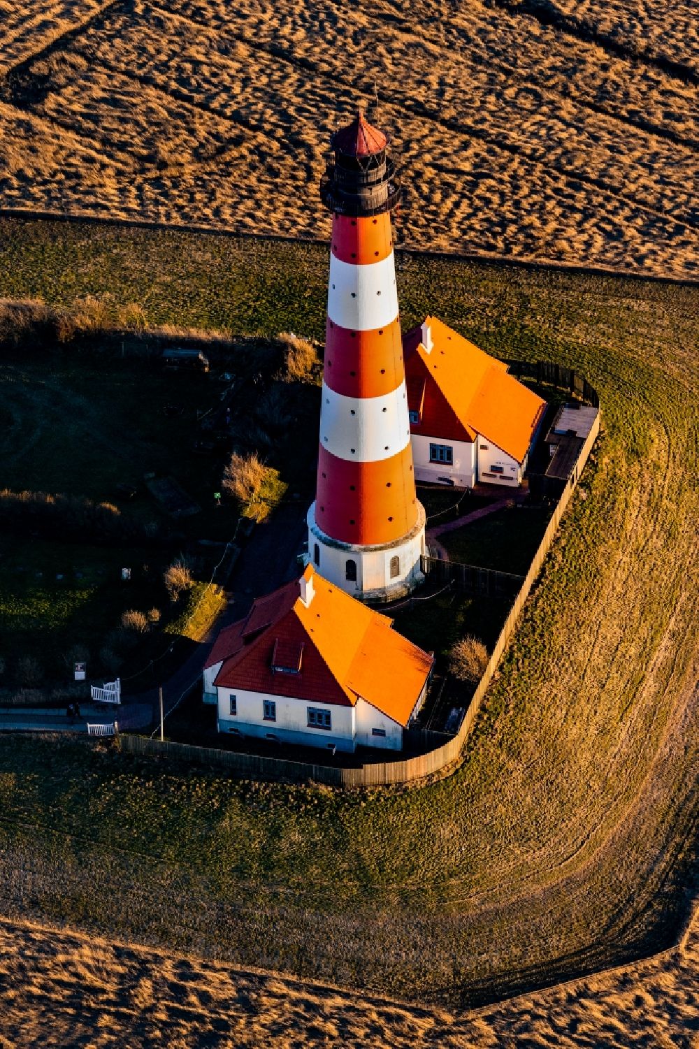 Aerial image Tating - Lighthouse as a historical navigation sign in the coastal area Westerheversand in the district of Hauert in Westerhever in the federal state Schleswig-Holstein