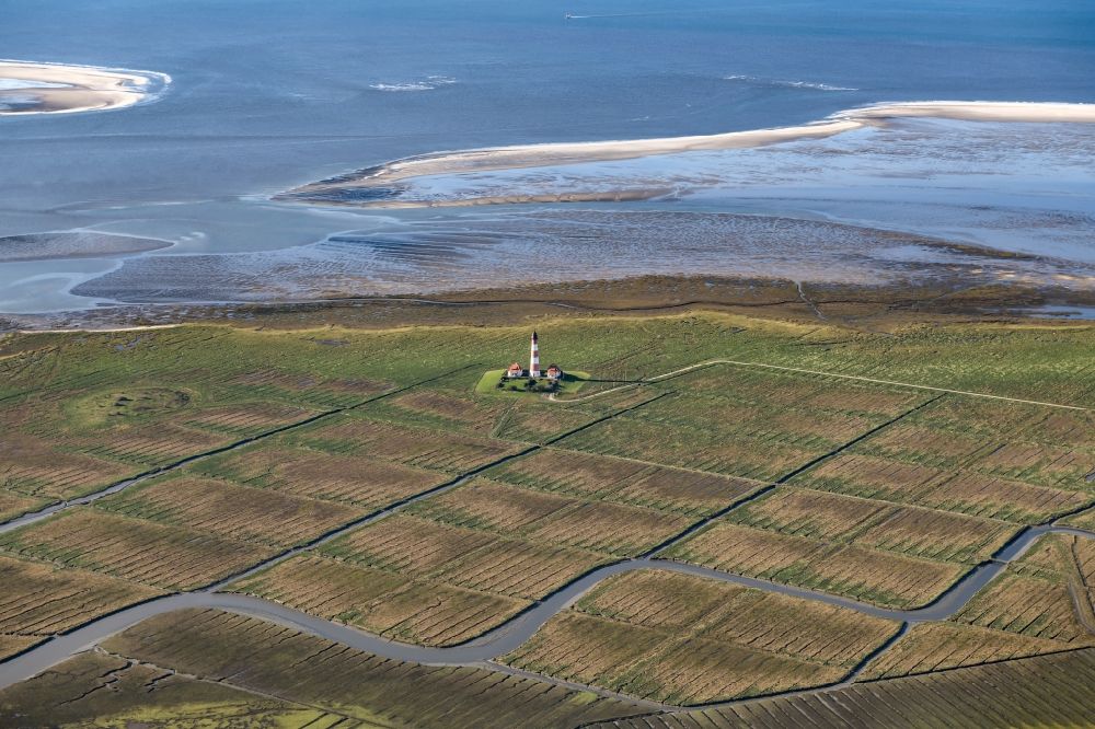 Aerial image Tating - Lighthouse as a historical navigation sign in the coastal area Westerheversand in the district of Hauert in Westerhever in the federal state Schleswig-Holstein