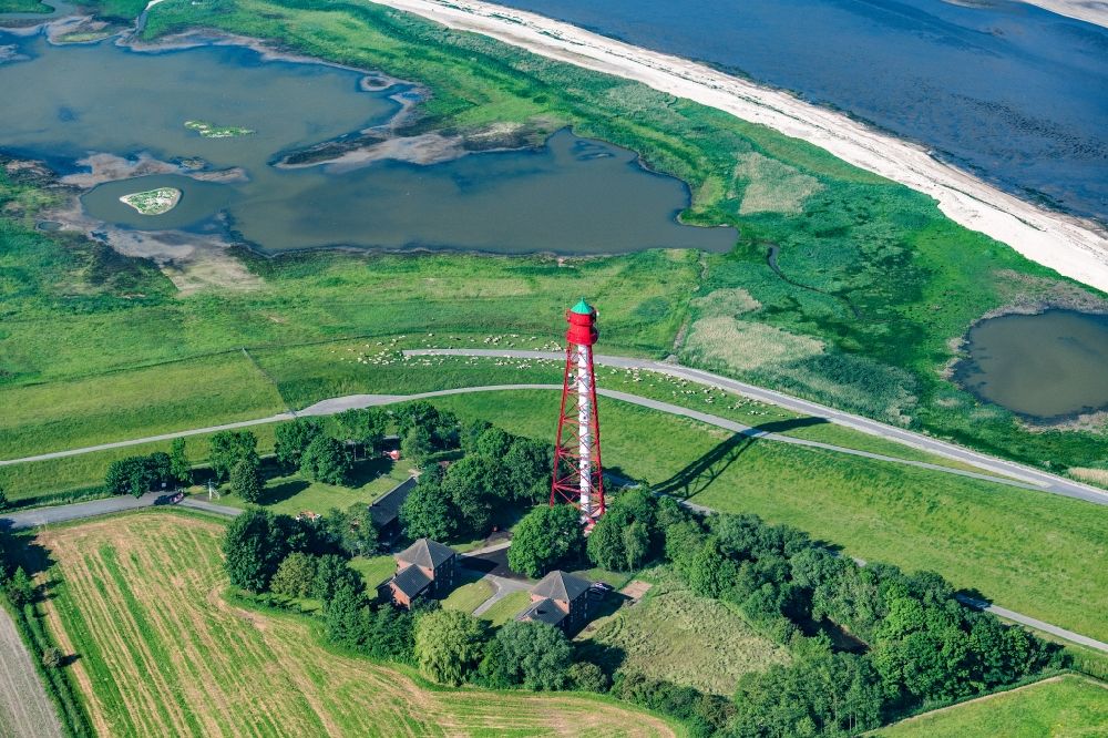 Krummhörn from the bird's eye view: Lighthouse as a historic seafaring character Campener Leuchtturm in Krummhoern in the state Lower Saxony, Germany