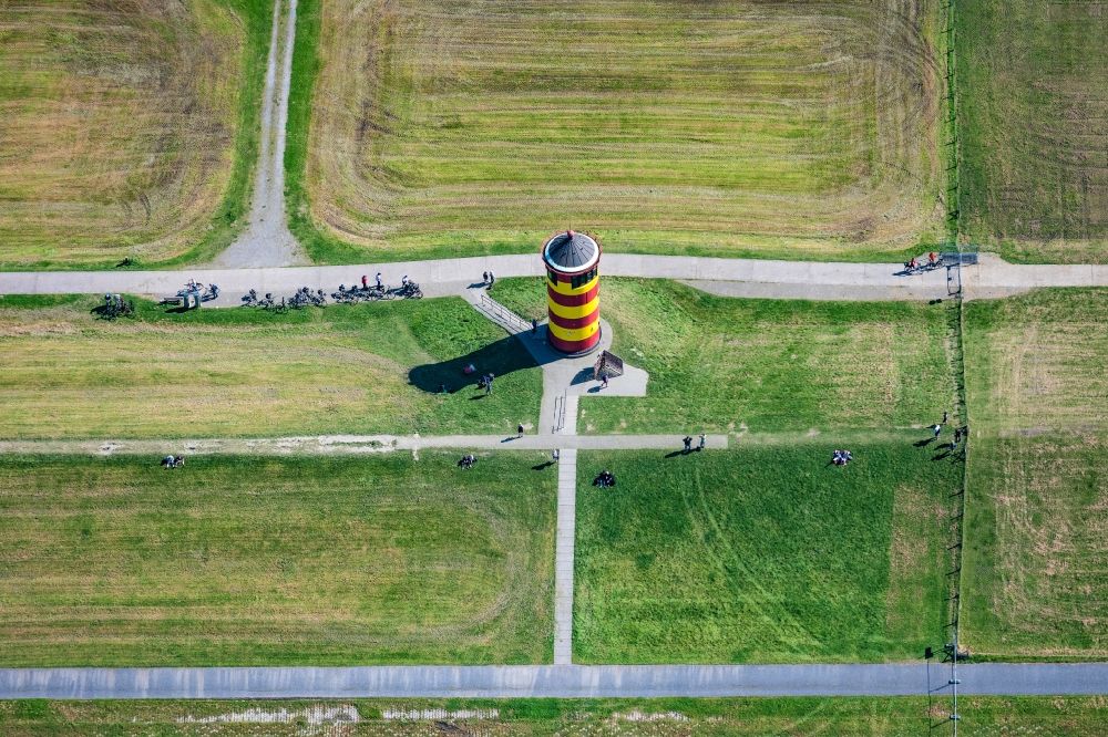 Krummhörn from above - Lighthouse as the historical nautical sign Pilsum lighthouse in Krummhorn in the state Lower Saxony, Germany