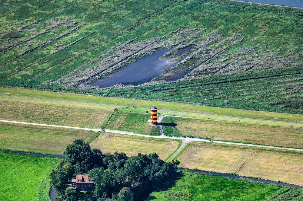 Krummhörn from the bird's eye view: Lighthouse as the historical nautical sign Pilsum lighthouse in Krummhorn in the state Lower Saxony, Germany