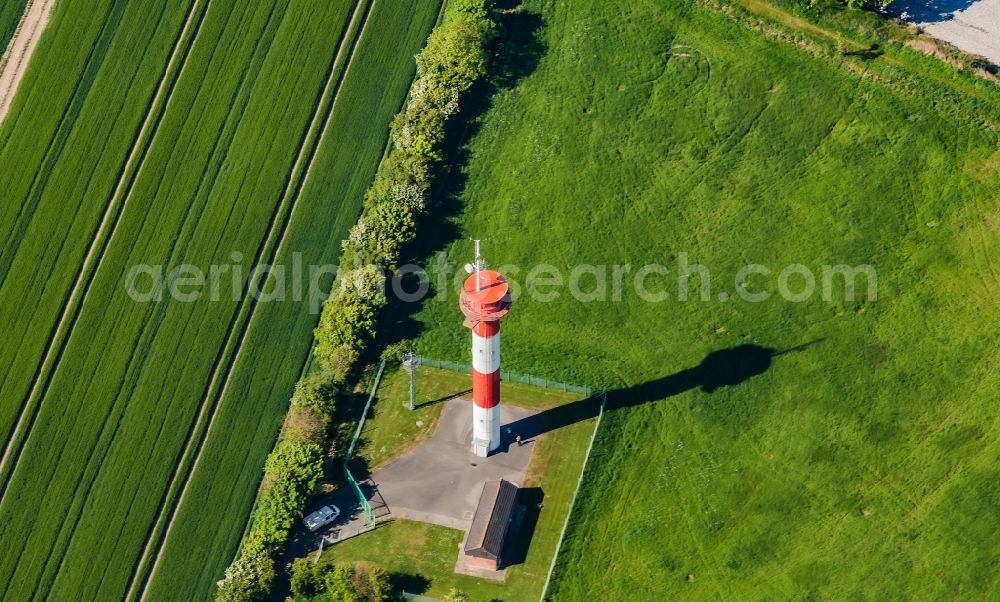 Fehmarn from above - Lighthouse as an intact seafaring sign in Marienlampe in Fehmarn on the island of Fehmarn in the state Schleswig-Holstein, Germany. The red and white striped tower serves as a cross mark light and orientation light