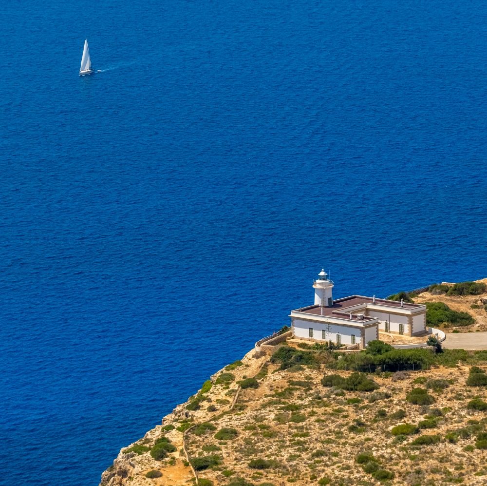 Llucmajor from the bird's eye view: Lighthouse near Rock Coastline on the cliffs Far de Cap Blanc in Llucmajor in Balearische Insel Mallorca, Spain