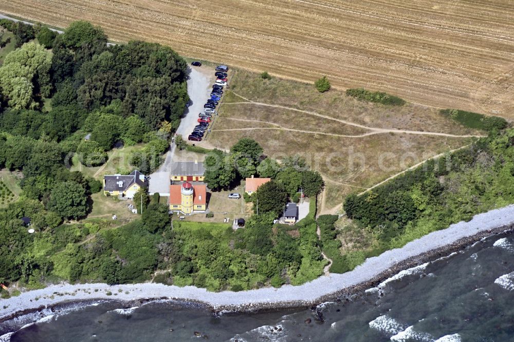 Aerial image Borre - Lighthouse Moen Fyr as a historic seafaring character in the coastal area in Borre in Region Sjaelland, Denmark