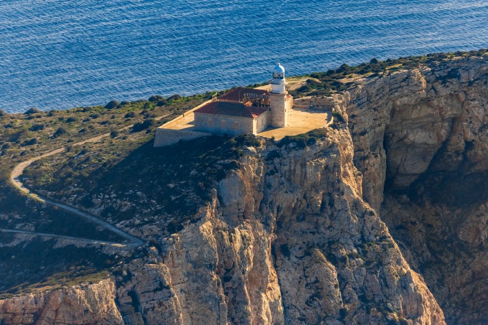 Andratx from the bird's eye view: Lighthouse on the rocky cliffs of the Badia de Pollenca on the Mediterranean island Sa Dragonera an natural park in Andratx in Mallorca in Balearic Islands, Spain