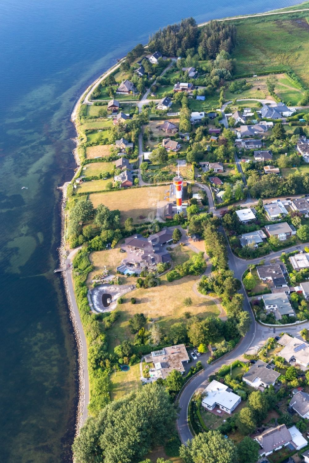 Aerial photograph Glücksburg - Lighthouse as a historic seafaring character in the coastal area of Foerde in Schausende in the state Schleswig-Holstein, Germany