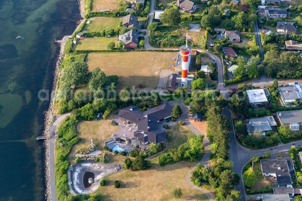 Glücksburg from above - Lighthouse as a historic seafaring character in the coastal area of Foerde in Schausende in the state Schleswig-Holstein, Germany