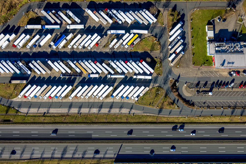 Hamm from above - Truck parking areas at the motorway rest area and parking lot of the BAB A2 in Rhynern in the Ruhr area in the state North Rhine-Westphalia, Germany