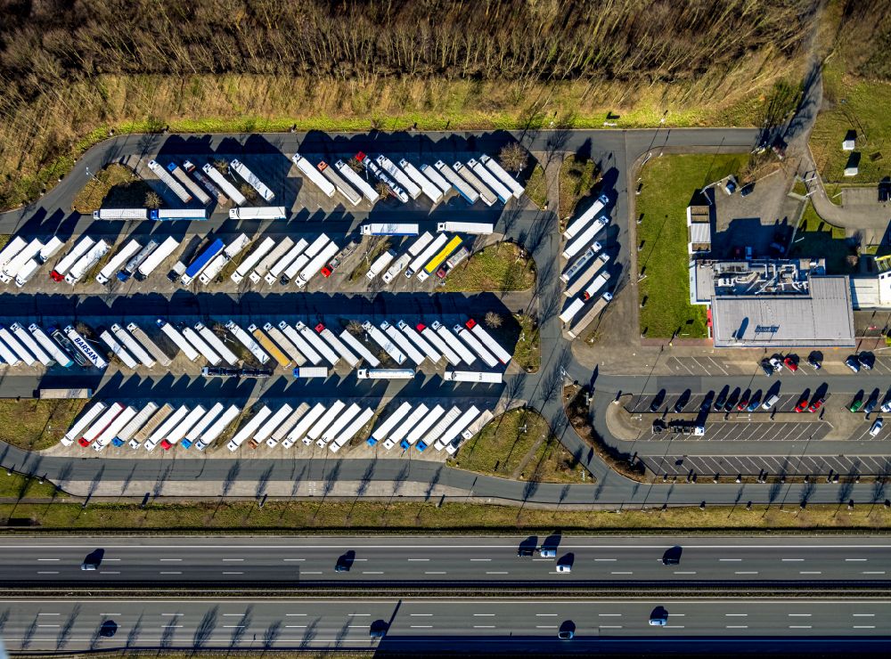 Hamm from the bird's eye view: Truck parking areas at the motorway rest area and parking lot of the BAB A2 in Rhynern in the Ruhr area in the state North Rhine-Westphalia, Germany