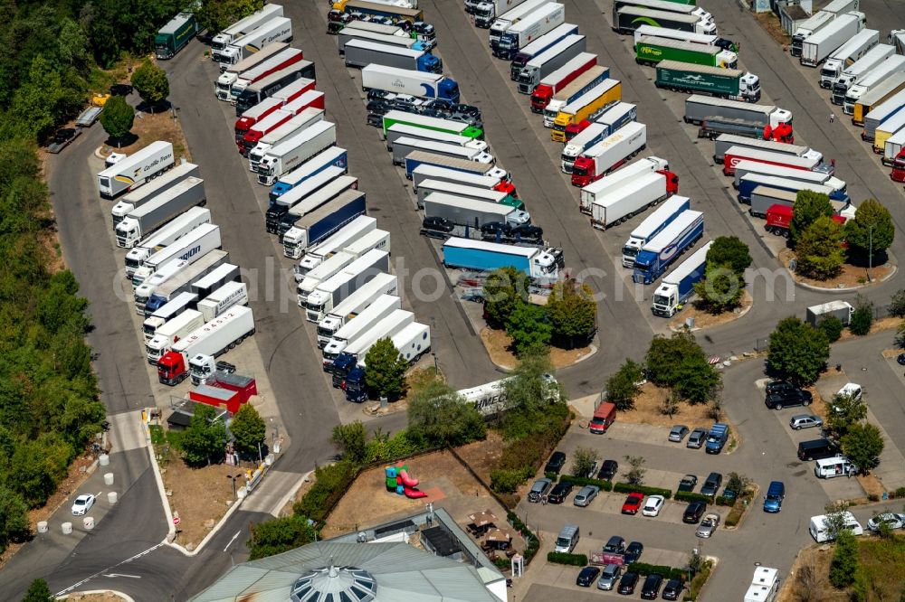 Aerial photograph Hartheim am Rhein - Lorries - parking spaces at the highway rest stop and parking of the BAB A 5 in Hartheim am Rhein in the state Baden-Wurttemberg, Germany