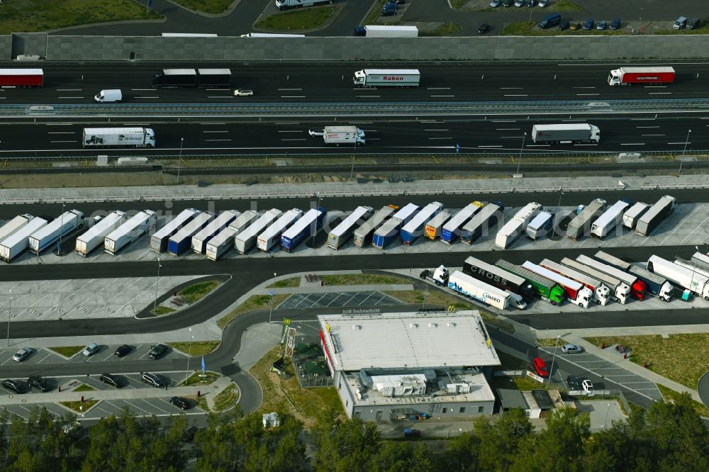 Michendorf from the bird's eye view: Lorries - parking spaces at the highway rest stop and parking of the BAB A 10 in Michendorf in the state Brandenburg, Germany