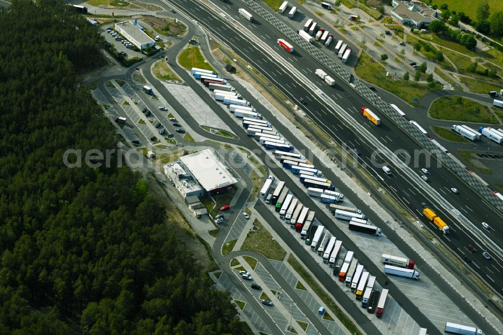 Aerial image Michendorf - Lorries - parking spaces at the highway rest stop and parking of the BAB A 10 in Michendorf in the state Brandenburg, Germany