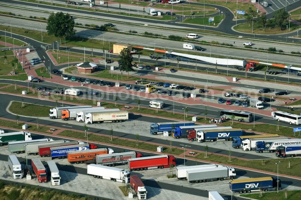 Bispingen from the bird's eye view: Lorries - parking spaces at the highway rest stop and parking of the BAB A 7 E45 on Raststaette Brunautal West in Bispingen in the state Lower Saxony