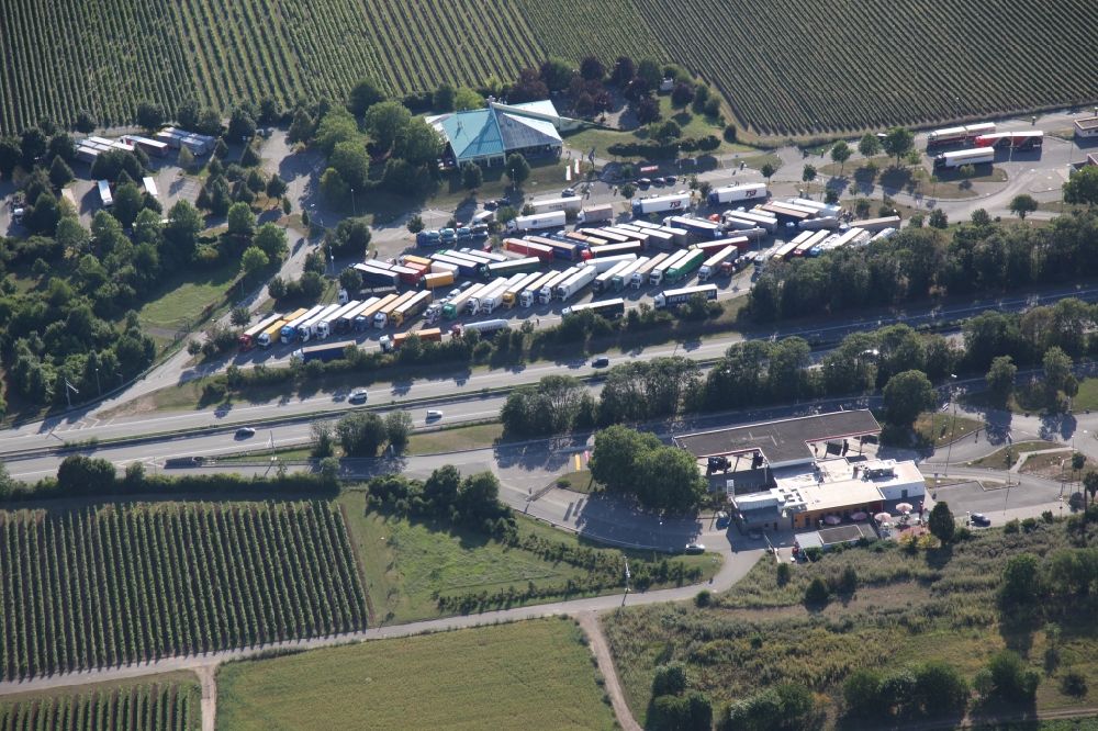 Worms from above - Lorries - parking spaces at the highway rest stop and parking of the BAB A 61 Service Station Wonnegau in Worms in the state Rhineland-Palatinate, Germany