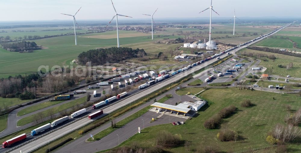 Frankfurt (Oder) from above - Lorries crowded in traffic jams in the lanes of the route of the motorway on Rastplatz of BAB A12 in Frankfurt (Oder) in the state Brandenburg, Germany